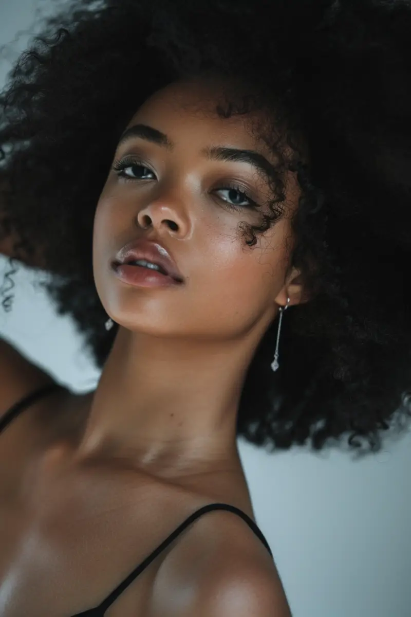 a woman wearing Pandora earrings